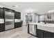 Modern kitchen with stainless steel appliances and an eat-in kitchen area at 5590 Whispering Woods Pt, Sanford, FL 32771