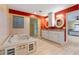 Bathroom featuring a soaking tub and double vanity sinks, complemented by bright and inviting colors at 5737 Masters Blvd, Orlando, FL 32819