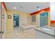 Bright bathroom showcases a soaking tub, granite vanity, and a walk-in closet for ample storage at 5737 Masters Blvd, Orlando, FL 32819