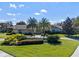 Stunning curb appeal with mature palm trees and manicured lawn at 5737 Masters Blvd, Orlando, FL 32819