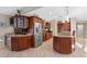 Spacious kitchen boasts stainless steel appliances, granite countertops, and custom cabinetry for storage and style at 5737 Masters Blvd, Orlando, FL 32819