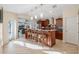 Island kitchen with granite countertops and wood cabinetry at 5737 Masters Blvd, Orlando, FL 32819