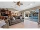 Open concept living room with backyard pool access, lots of room to sit, and lots of light at 5737 Masters Blvd, Orlando, FL 32819