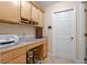 Well-lit office space with built-in desk, cabinets, and a convenient stool at 5737 Masters Blvd, Orlando, FL 32819