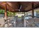 Awesome outdoor kitchen with bar seating and large built-in grill and countertops at 5737 Masters Blvd, Orlando, FL 32819