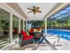 Relaxing pool area with covered patio and seating at 5737 Masters Blvd, Orlando, FL 32819