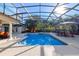 Inviting pool with covered patio and outdoor furniture at 5737 Masters Blvd, Orlando, FL 32819