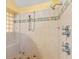 Large walk-in shower with built-in seat and decorative tile at 5737 Masters Blvd, Orlando, FL 32819