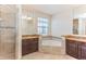 Elegant bathroom with corner soaking tub and double vanities at 8146 Prestbury Dr, Orlando, FL 32832