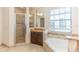 Large bathroom with soaking tub, shower, and double vanity at 8146 Prestbury Dr, Orlando, FL 32832