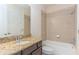 Clean bathroom with shower/tub combo and granite vanity at 8146 Prestbury Dr, Orlando, FL 32832