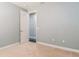 Simple bedroom with an open door to hallway at 8146 Prestbury Dr, Orlando, FL 32832