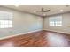 Spacious bonus room with hardwood floors and ceiling fan at 8146 Prestbury Dr, Orlando, FL 32832