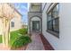 Brick walkway leading to double doors with glass inserts at 8146 Prestbury Dr, Orlando, FL 32832