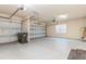 Double garage with opener, window, and extra storage at 8146 Prestbury Dr, Orlando, FL 32832