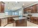 Eat-in kitchen with granite countertops and island at 8146 Prestbury Dr, Orlando, FL 32832