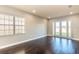 Living room with hardwood floors and French doors at 8146 Prestbury Dr, Orlando, FL 32832