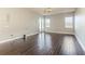 Living room featuring hardwood floors and french doors at 8146 Prestbury Dr, Orlando, FL 32832