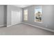 Spacious bedroom with double doors and carpet at 8226 Nemours Pkwy, Orlando, FL 32827