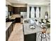 Open kitchen features granite island, stainless steel appliances at 8226 Nemours Pkwy, Orlando, FL 32827