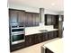 Modern kitchen with stainless steel appliances and ample cabinetry at 8226 Nemours Pkwy, Orlando, FL 32827