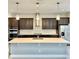 Spacious kitchen with dark cabinetry and quartz countertops at 8226 Nemours Pkwy, Orlando, FL 32827