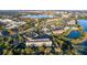 Aerial view of shopping center near a lake at 8312 Via Rosa, Orlando, FL 32836