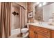 Bathroom with shower/tub combo and wood vanity at 8312 Via Rosa, Orlando, FL 32836