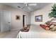 Bright bedroom featuring a ceiling fan and large windows at 8312 Via Rosa, Orlando, FL 32836