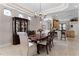 Bright dining room with a view of the kitchen, showcasing a formal dining setting at 8312 Via Rosa, Orlando, FL 32836