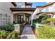 Brick pathway leads to the front entrance with a decorative wrought-iron gate at 8312 Via Rosa, Orlando, FL 32836