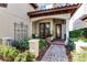 Brick pathway leads to the front entrance with a decorative wrought-iron gate at 8312 Via Rosa, Orlando, FL 32836