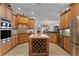 Large kitchen with island, wood cabinets, and stainless steel appliances at 8312 Via Rosa, Orlando, FL 32836