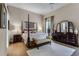 Luxurious main bedroom with a four-poster bed and private access to the balcony at 8312 Via Rosa, Orlando, FL 32836