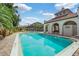 Inviting community pool with lounge chairs at 8312 Via Rosa, Orlando, FL 32836