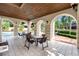 Relaxing poolside patio area with tables and grill at 8312 Via Rosa, Orlando, FL 32836