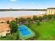 Community tennis court with lake view at 8312 Via Rosa, Orlando, FL 32836