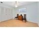 Bedroom with light walls, hardwood floors, and double doors to closet at 846 Leopard Trl, Winter Springs, FL 32708