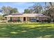 Charming ranch home with stone facade and spacious lawn at 846 Leopard Trl, Winter Springs, FL 32708