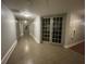 Inviting hallway with neutral walls, recessed lighting, and stylish tiled flooring leads to various rooms and amenities at 860 N Orange Ave # 163, Orlando, FL 32801