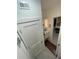 Hallway with modern white doors and trim with view to modern bathroom at 860 N Orange Ave # 163, Orlando, FL 32801