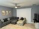 Spacious living room with sectional sofa and access to patio at 8973 Azalea Sands Ln # 8973, Davenport, FL 33896