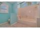 Light teal bathroom with a single vanity and tub at 926 Freshmeadow Ct, Apopka, FL 32703