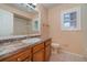 Clean bathroom with wood vanity and updated fixtures at 926 Freshmeadow Ct, Apopka, FL 32703