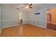 Spacious bedroom with light wood flooring and ceiling fan at 926 Freshmeadow Ct, Apopka, FL 32703