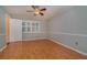 Spacious bedroom with hardwood floors and ceiling fan at 926 Freshmeadow Ct, Apopka, FL 32703