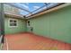 Screened deck with light green walls and wood flooring at 926 Freshmeadow Ct, Apopka, FL 32703