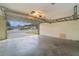 Garage with an open door, overhead storage, and concrete floor at 926 Freshmeadow Ct, Apopka, FL 32703