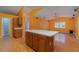 Kitchen features an island and opens to living area at 926 Freshmeadow Ct, Apopka, FL 32703