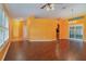 Spacious living room with hardwood floors and an archway at 926 Freshmeadow Ct, Apopka, FL 32703